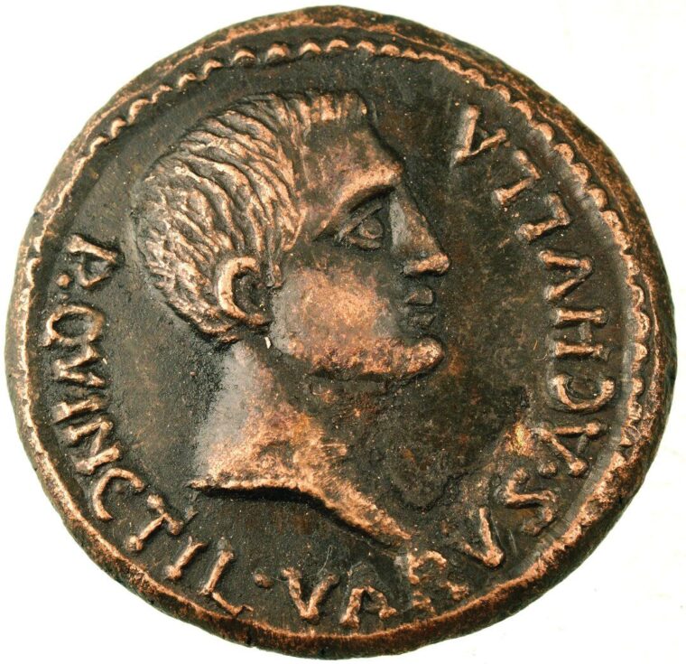 Replica of a bronze Roman coin with a bust of Varus and the inscription, “Publis Quinctilius Varus, Achulla,” minted during the time he served as governor of Byzacena (c. 7-6 BCE), a Late Roman province in the central part of Roman North Africa, which is now roughly Tunisia. Achulla was a Roman-Berber city on the Mediterranean coast.