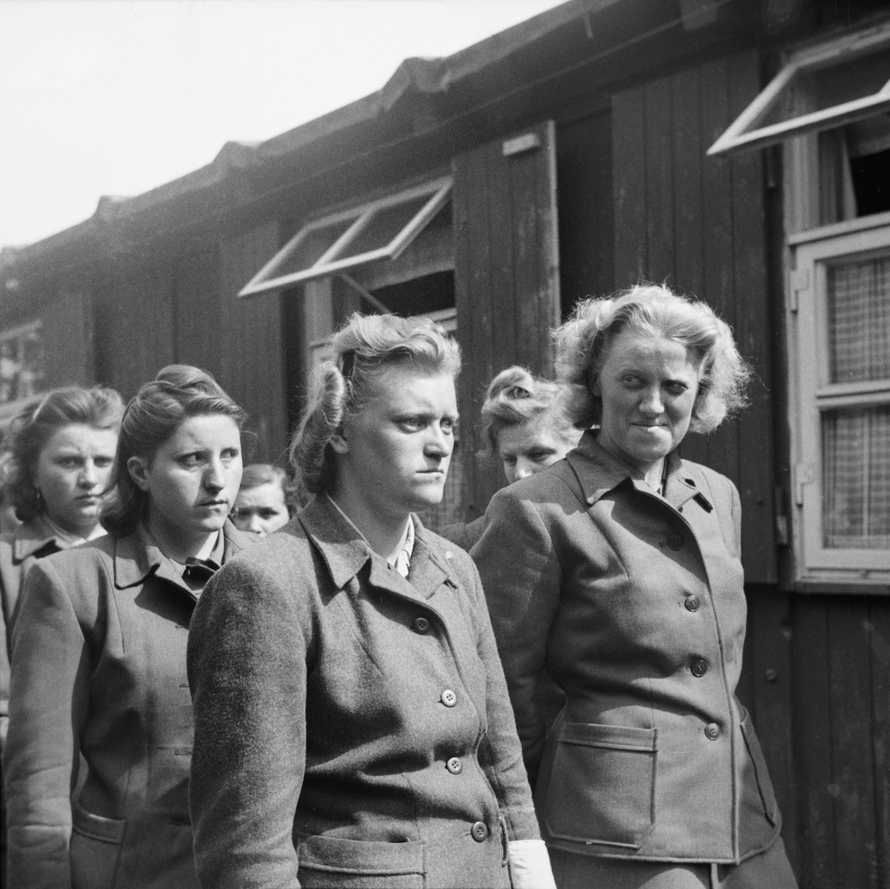 After the British liberated Bergen-Belsen on April 15, 1945, the female guards, shown here, were ordered to help bury the thousands of bodies. Pictured are Hildegard Kanbach (far left), Irene Haschke (center foreground), Head Wardress Elisabeth Volkenrath (second from right, partly hidden), and Herta Bothe (far right).