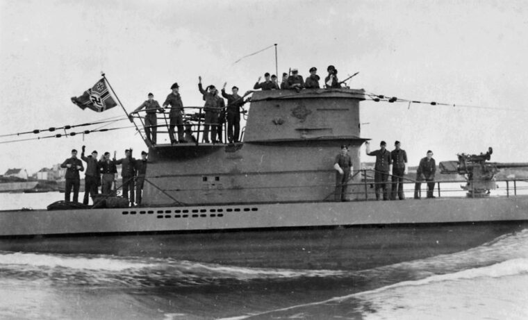 Crewmen aboard the German submarine U-203 return to the safety of a French port following a successful wartime cruise. During its brief career, the crew of U-203 sank 21 Allied merchant ships but was hunted down and sunk in 1943 by British Fairey Swordfish torpedo planes working in conjunction with the destroyer HMS Pathfinder.