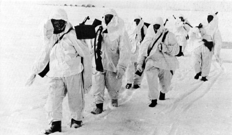 Experiencing the harshness of their first Russian winter, and short of proper attire, the Blue Division utilize white sheets as a means of camouflage.