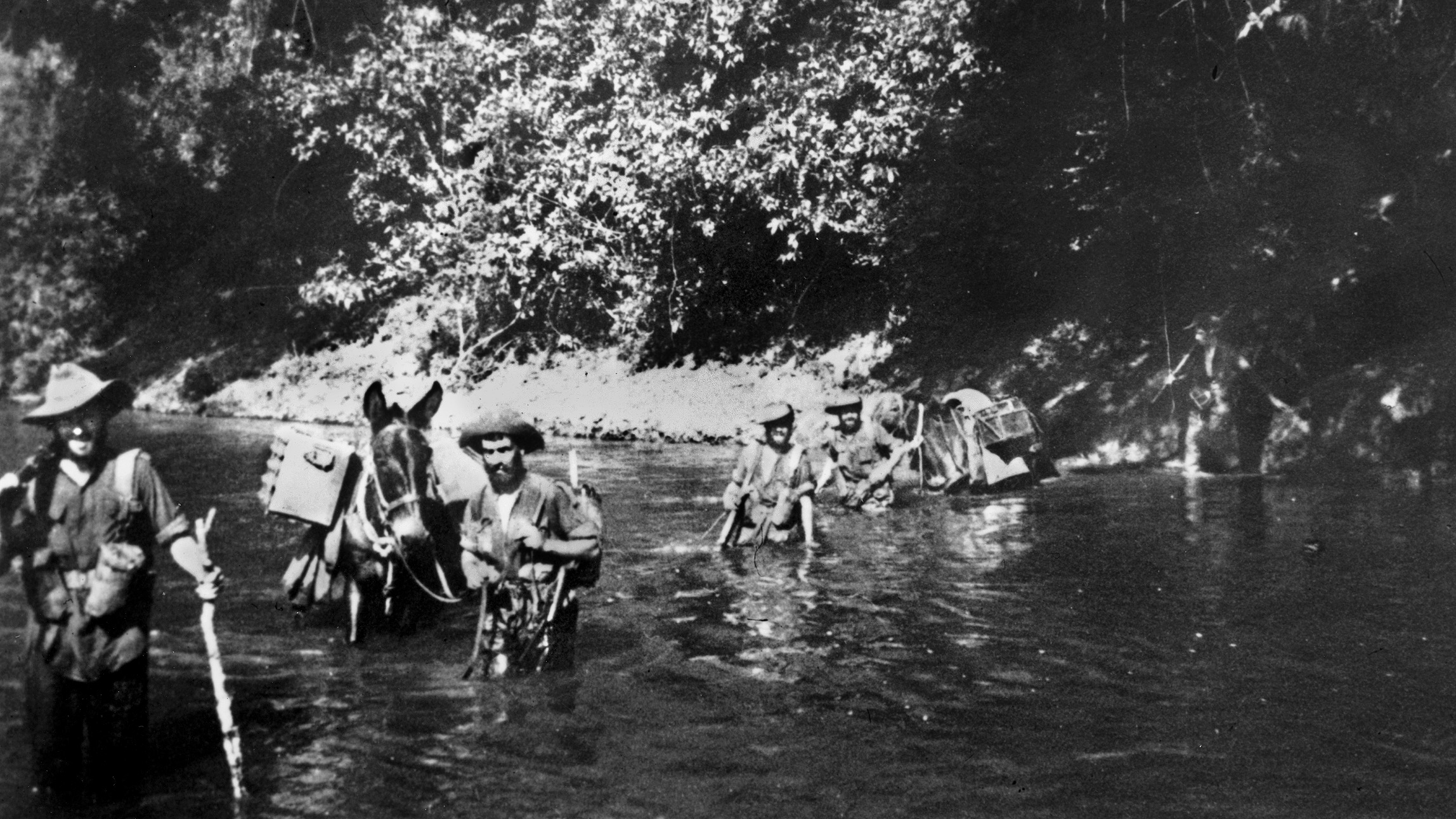 A group of the famed Chindits, commanded by eccentric Brigadier Orde Wingate, ford a stream with their pack animals somewhere in Burma.