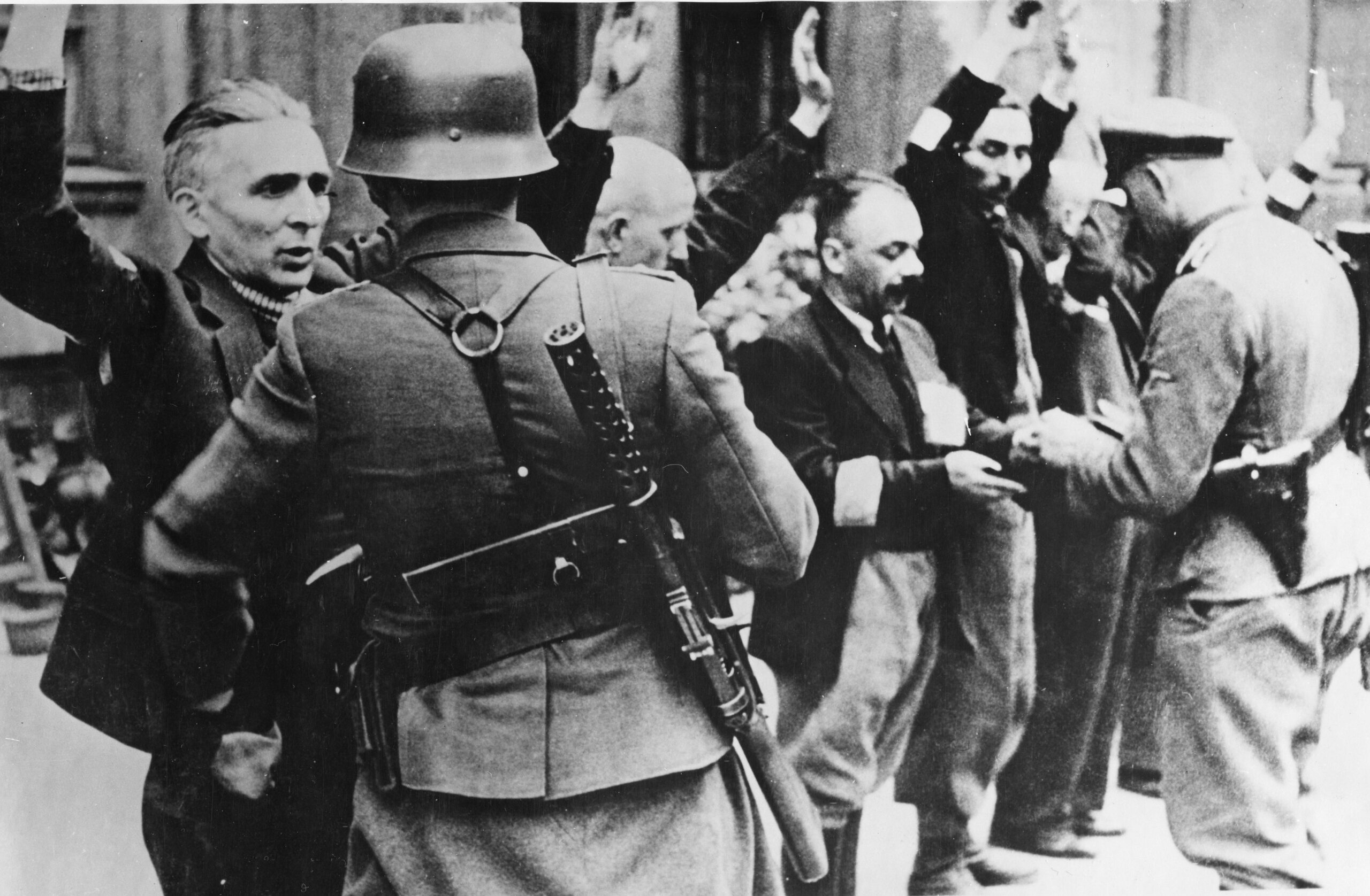 Polish captives, their hands in the air, are obviously apprehensive as German soldiers search them for weapons and contraband. The Germans were constantly wary of attacks by Polish guerrillas. 