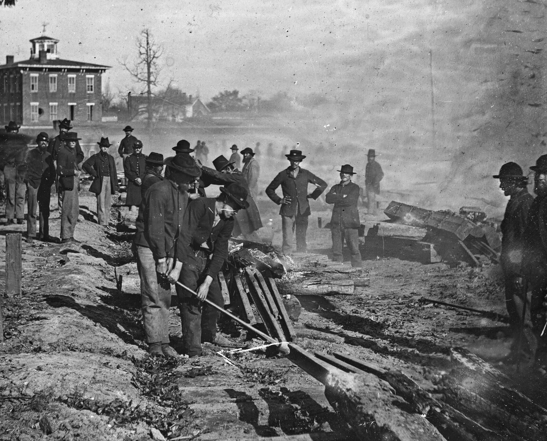 Maj. Gen. William Tecumseh Sherman’s notorious “bummers” destroy a section of railroad at Atlanta, Georgia, in the summer of 1864. Photographer George N. Barnard was one of the few to record the Civil War in the Western theater.