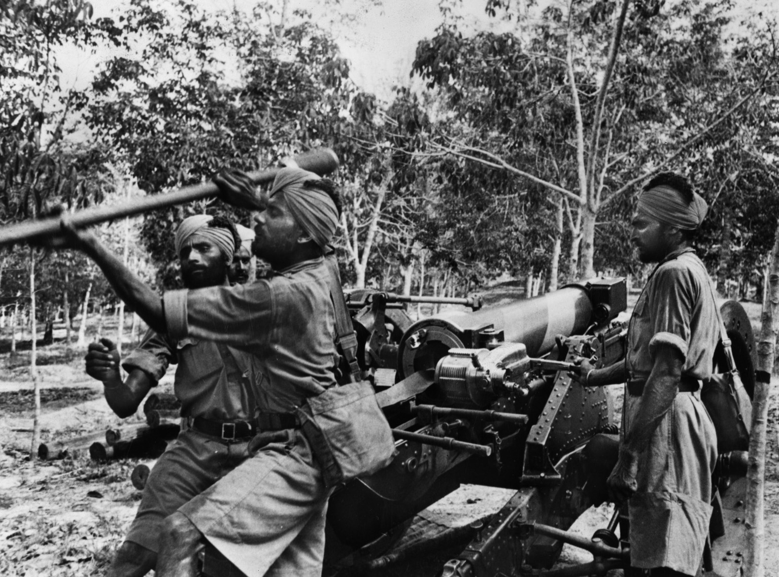 Soldiers from other parts of the British Empire defended Singapore. Here, Sikh soldiers train with an artillery piece in late 1941. They would be overrun by the Japanese.