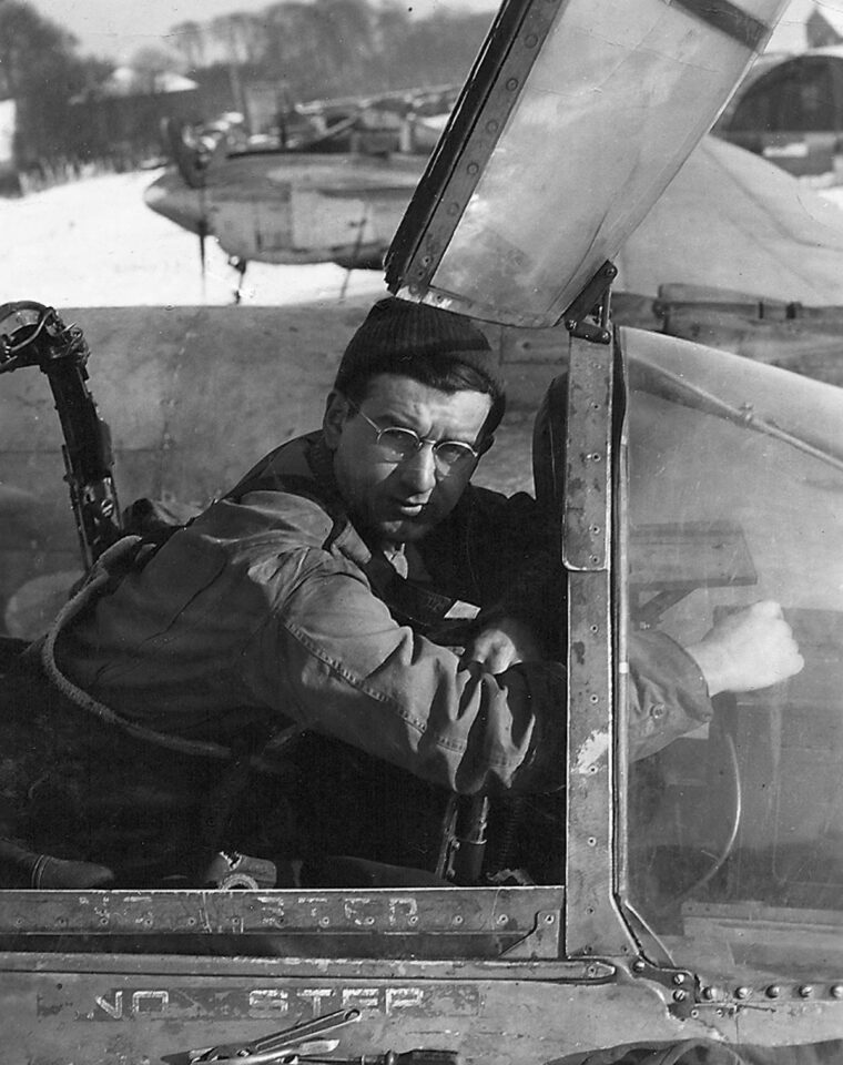 The photographer, Sergeant Charles D. Lemick, in the cockpit of a P-38 (F-5) Lightning.