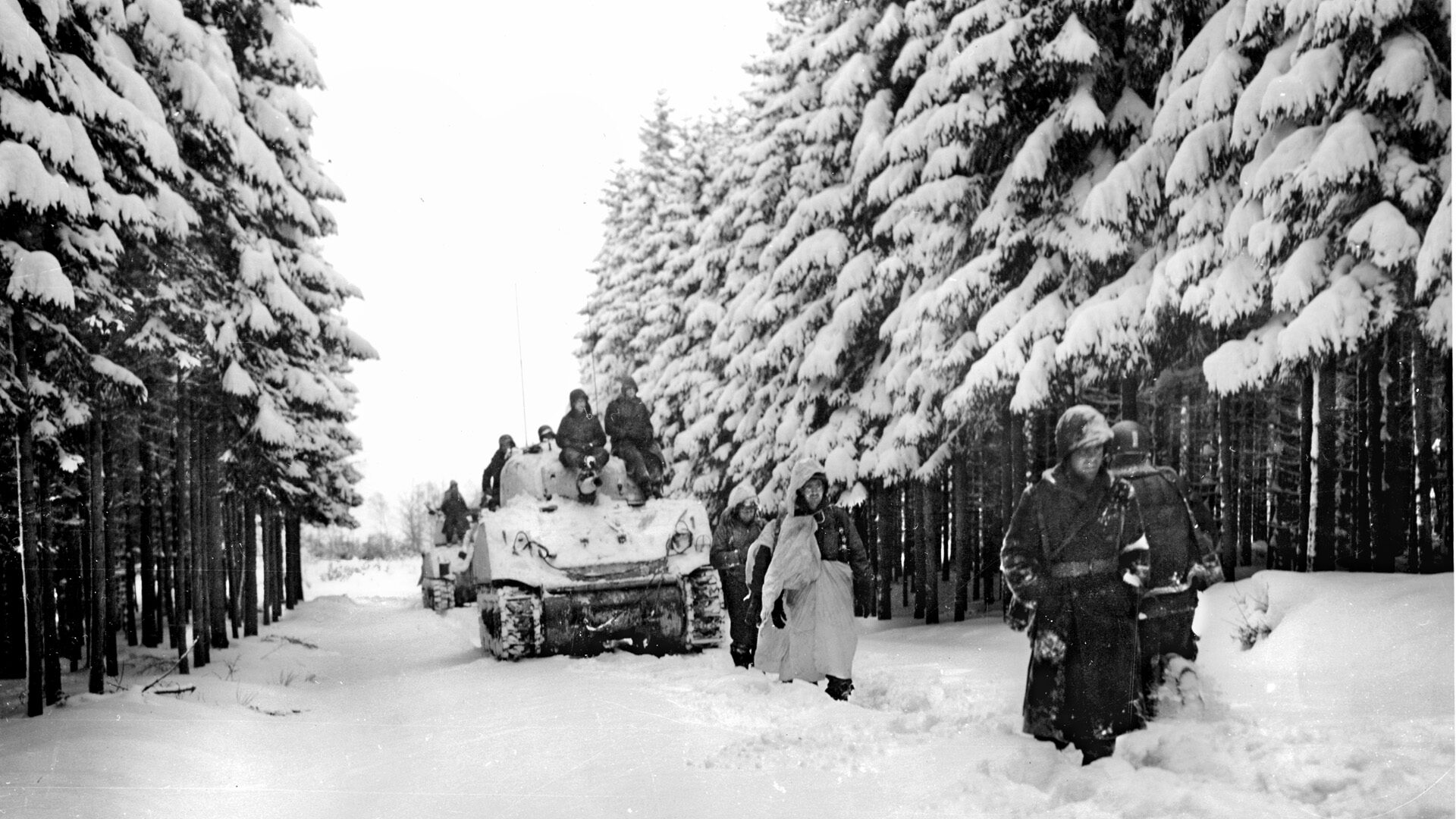 Moving into position to defend the town of Stoumont, Belgium, tanks and soldiers of the U.S. 740th Tank Battalion and paratroopers of the 82nd Airborne Division are confronted by the grim task of stemming Peiper's SS tide. 