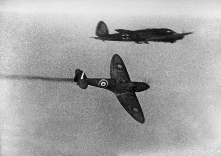 A British Spitfire attacks a German He-111 during the Battle of Britain. On August 25, 1940, an He-111 crew overshot its target and bombed London in the darkness, unleashing British reprisal attacks on Berlin.