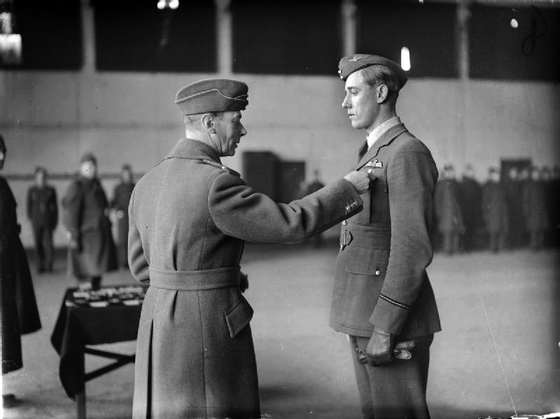 England’s King George VI confers a bar to the Distinguished Flying Cross to Hurricane Pilot Albert Gerald “Zulu” Lewis for shooting down five enemy aircraft in one day in September 1940.