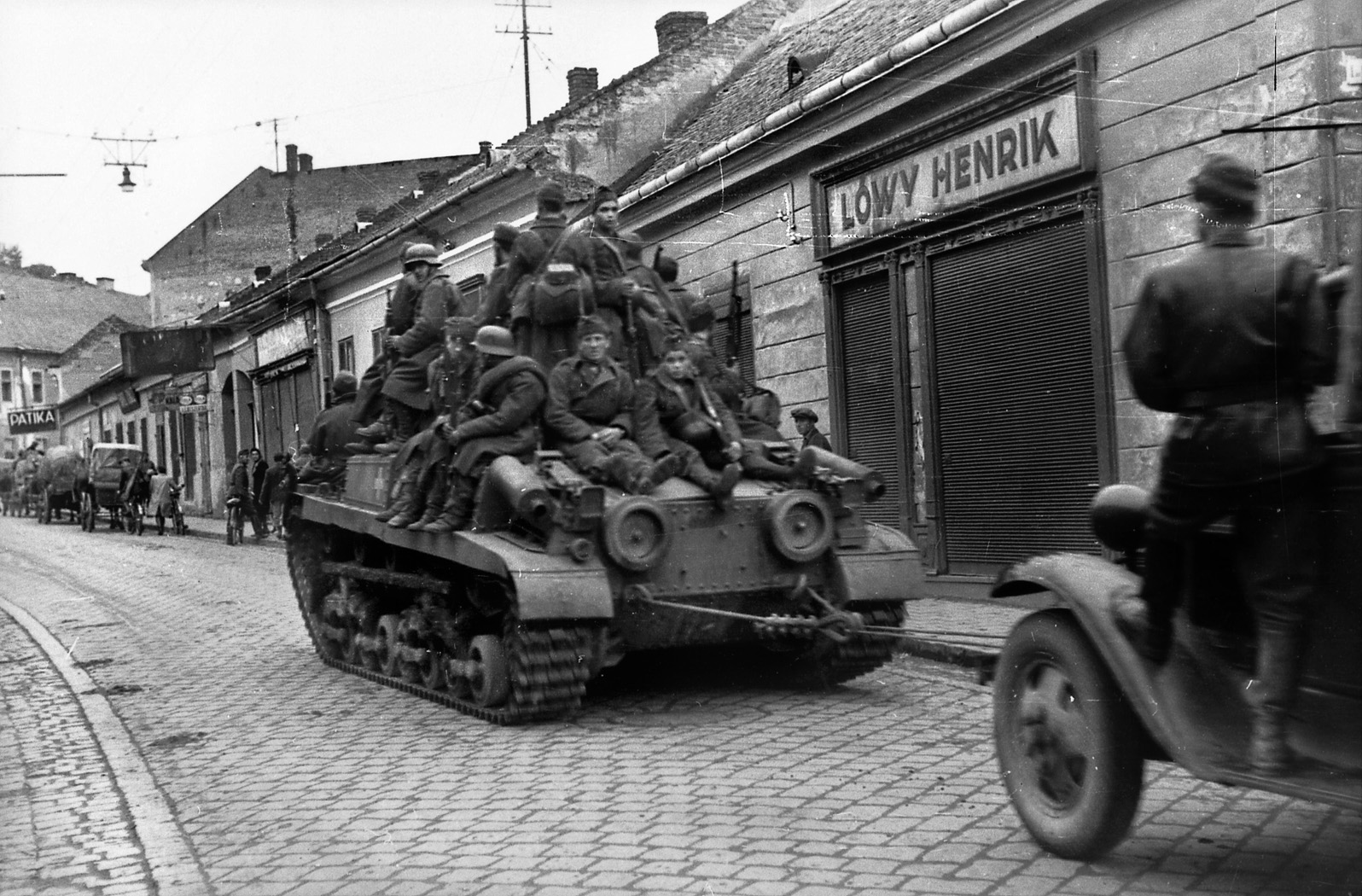 Hungarian troops ride a 41 M Turan II tank during the withdrawal of German and Hungarian troops from Romania to Hungary in August 1944. The Turan is also towing a truck. 