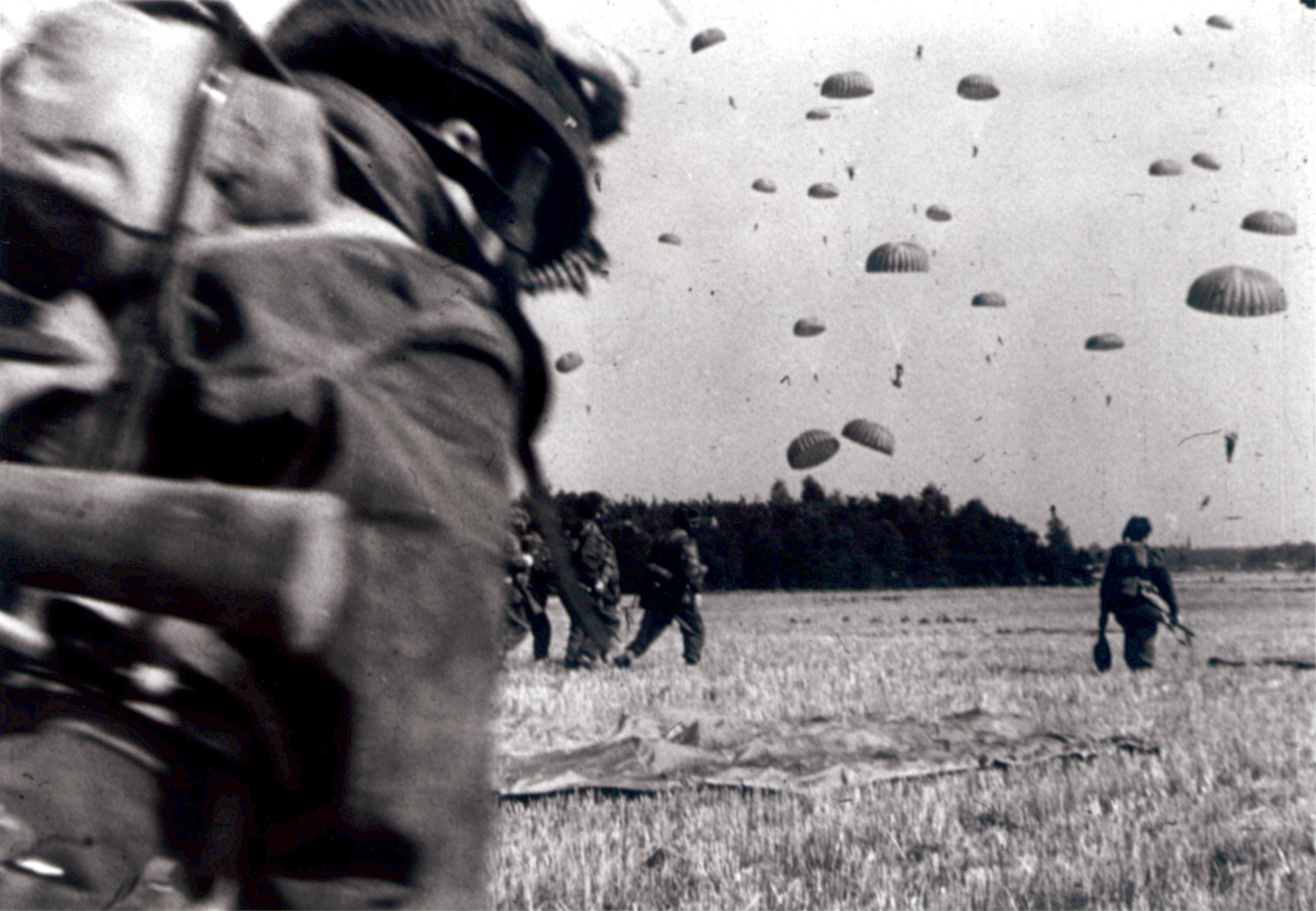 Paratroopers assemble and gather their equipment immediately after landing.
