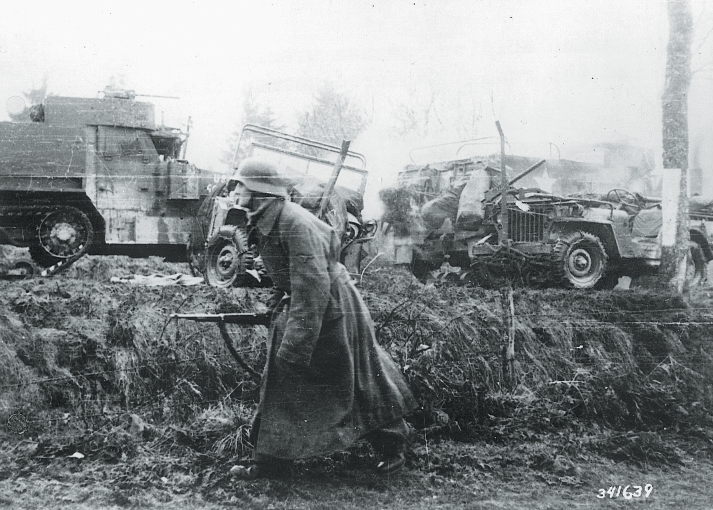 German SS troops move forward during the December phase of the battle.