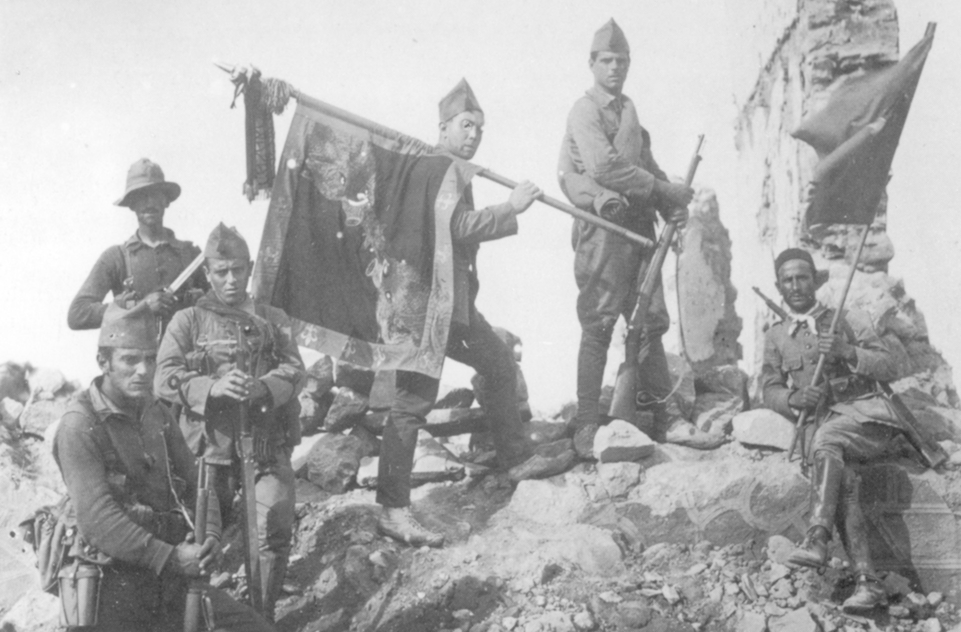 Armed with M93 Mauser rifles, men of the Spanish Foreign Legion stand after conquering a redoubt in the Moroccan mountains; they were fighting native chieftains.
