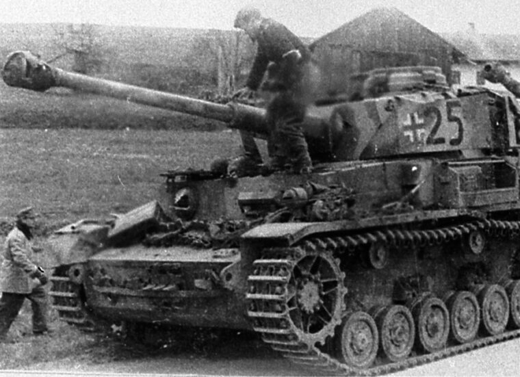 The lead Tiger of the 11th Panzer Division makes its surrender to U.S. forces in Area “B.”