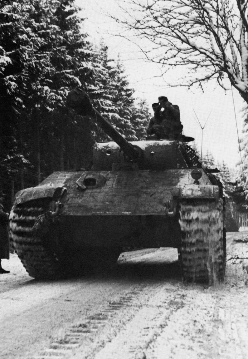 A German PzKpfw. V Panther medium tank rolls forward across a snow-covered road during the Battle of the Bulge in December 1944. The Panther mounted a high-velocity 75mm cannon and was considered one of the finest tanks of World War II.