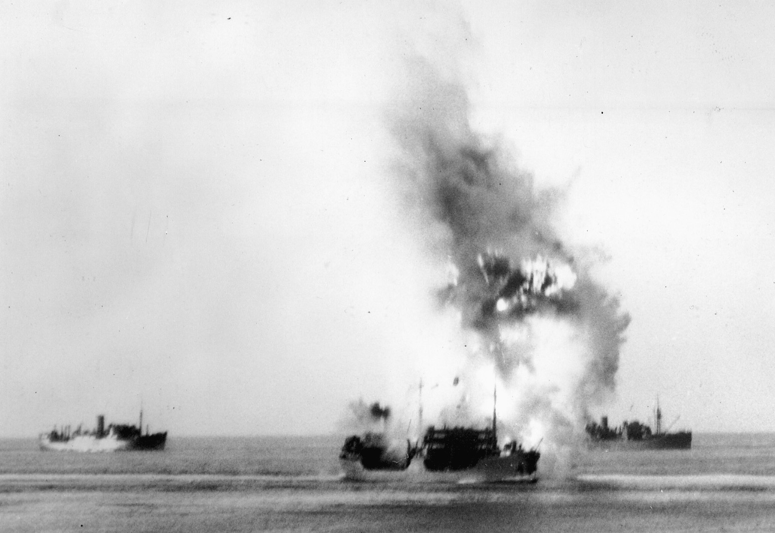 The merchant ship Ohio is struck portside by a torpedo from an Italian submarine during Operation Pedestal.