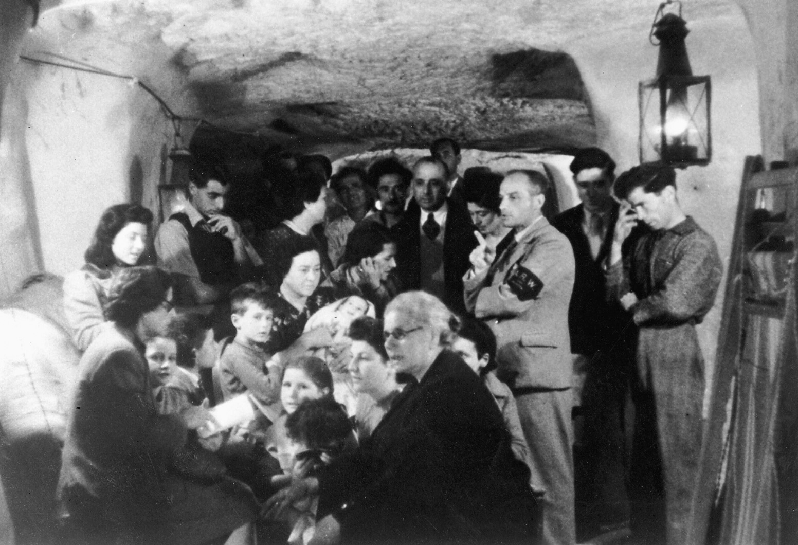 Maltese civilians huddle in the safety of an underground tunnel during one of the many air raids conducted by the Luftwaffe.