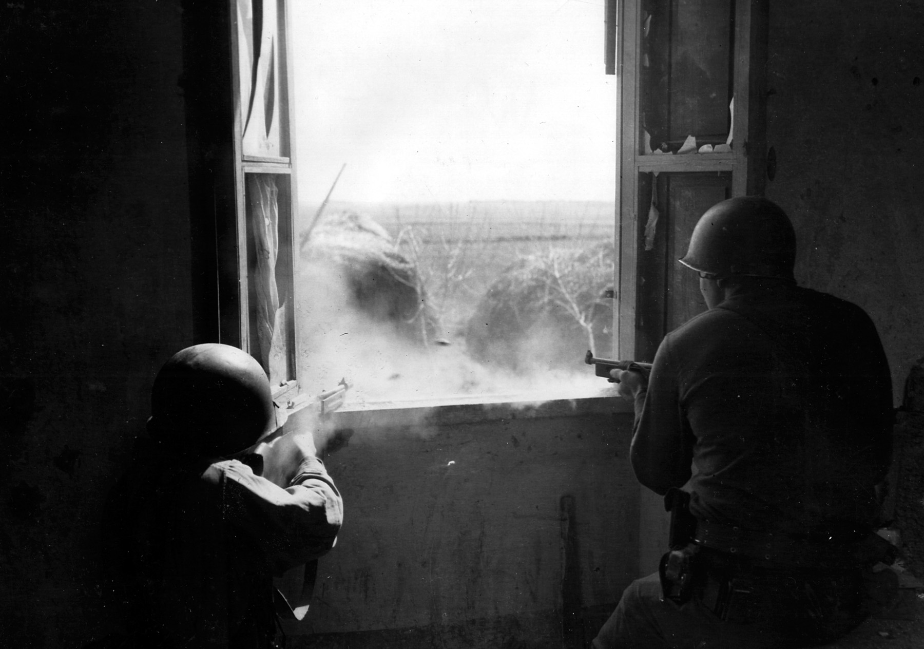 Two U.S. soldiers fire on an enemy position during action in Italy. Far from being a strike at the “soft underbelly” of Europe as British Prime Minister Winston Churchill had believed, the advance up the Italian boot was slow and costly.