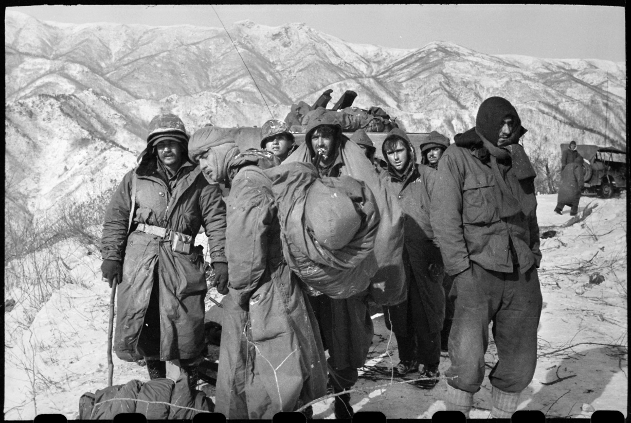 Wounded 7th Infantry Division soldiers and Marines await evacuation during the harrowing retreat from the Chosin Reservoir.
