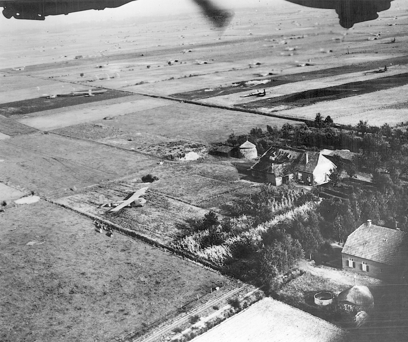 Consolidated B-24 Liberator bombers of the U.S. Army Air Forces fly over the Market-Garden glider landing zones in Holland while on their way to bomb a distant target on September 18, 1944.