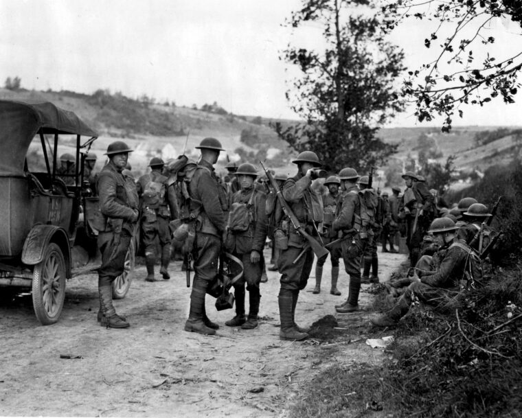 Doughboys in the 28th Infantry Regiment, 1st Division, carry M1903 Springfields near Soissons, France, in 1918.