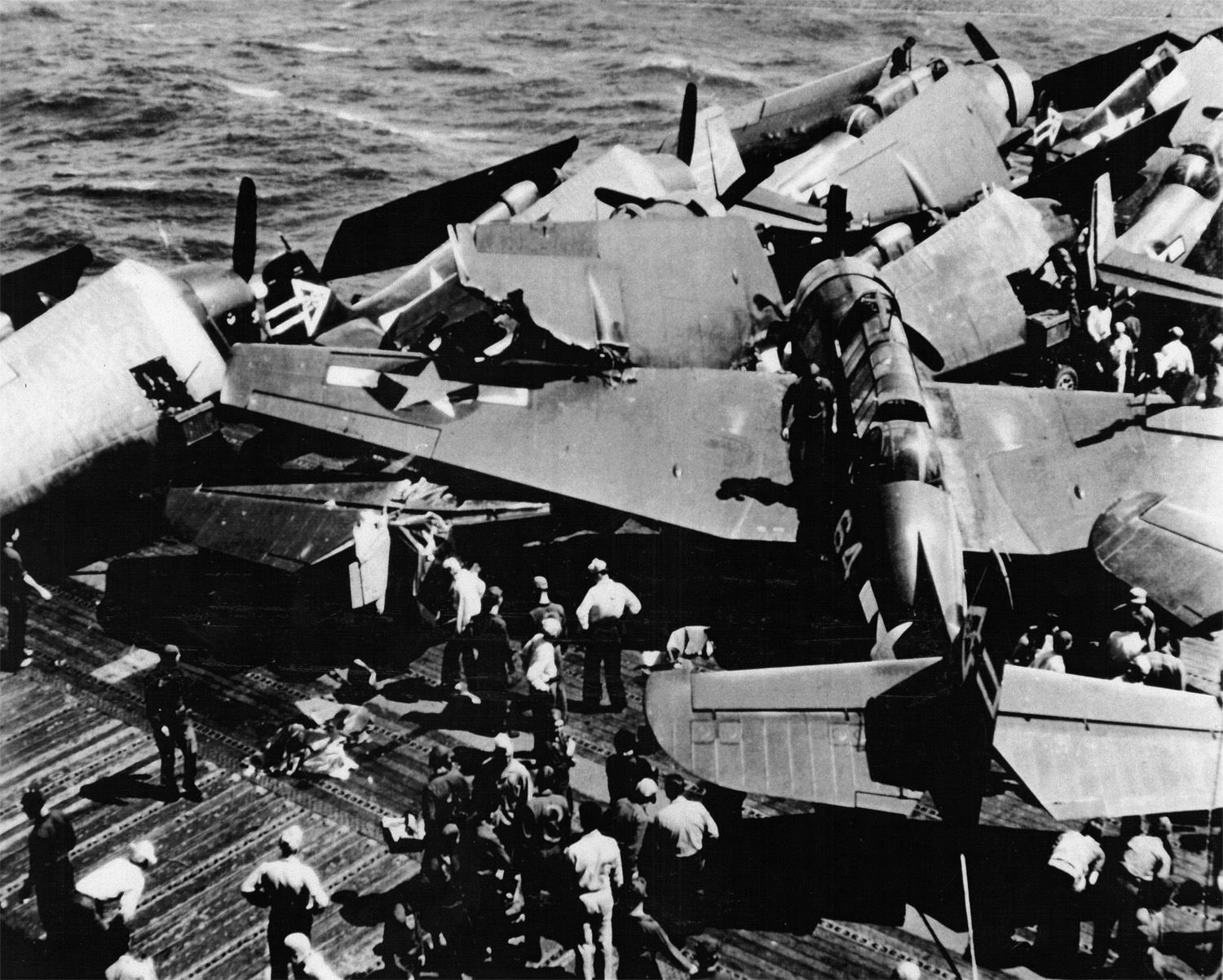 Barr also took this shot after a TBM Avenger missed the arresting wire during landing and crashed into parked planes onboard the Enterprise, April 11, 1945.