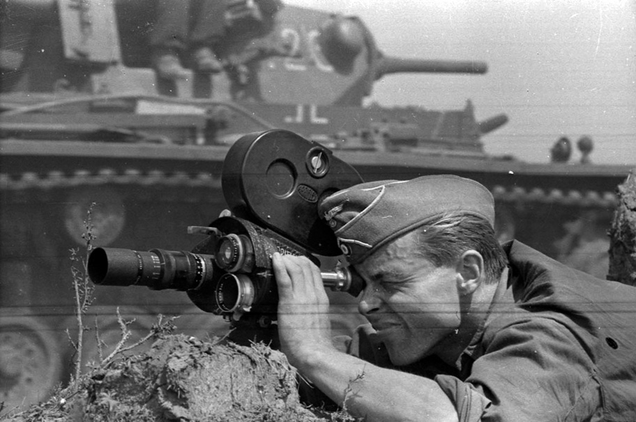 A German newsreel cameraman focuses on an armored column moving into the Soviet Union. Like their American and British counterparts, German cameramen superbly documented the war.