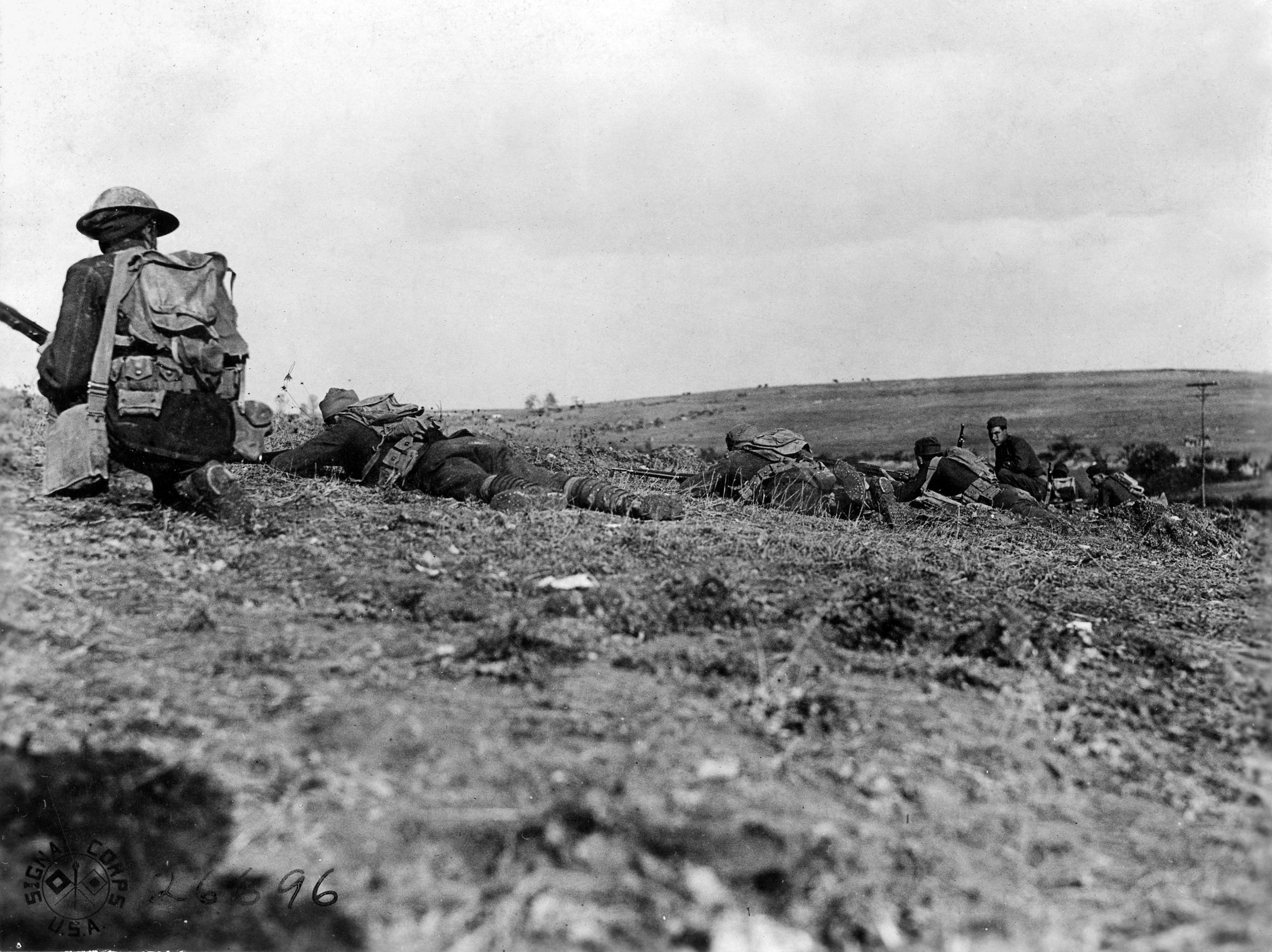 Troops of the 64th Infantry Brigade, 32nd Division, advance in support of the first line near Romagne-Sous-Montfaucon, France, in November 1918. The end of the war is near.