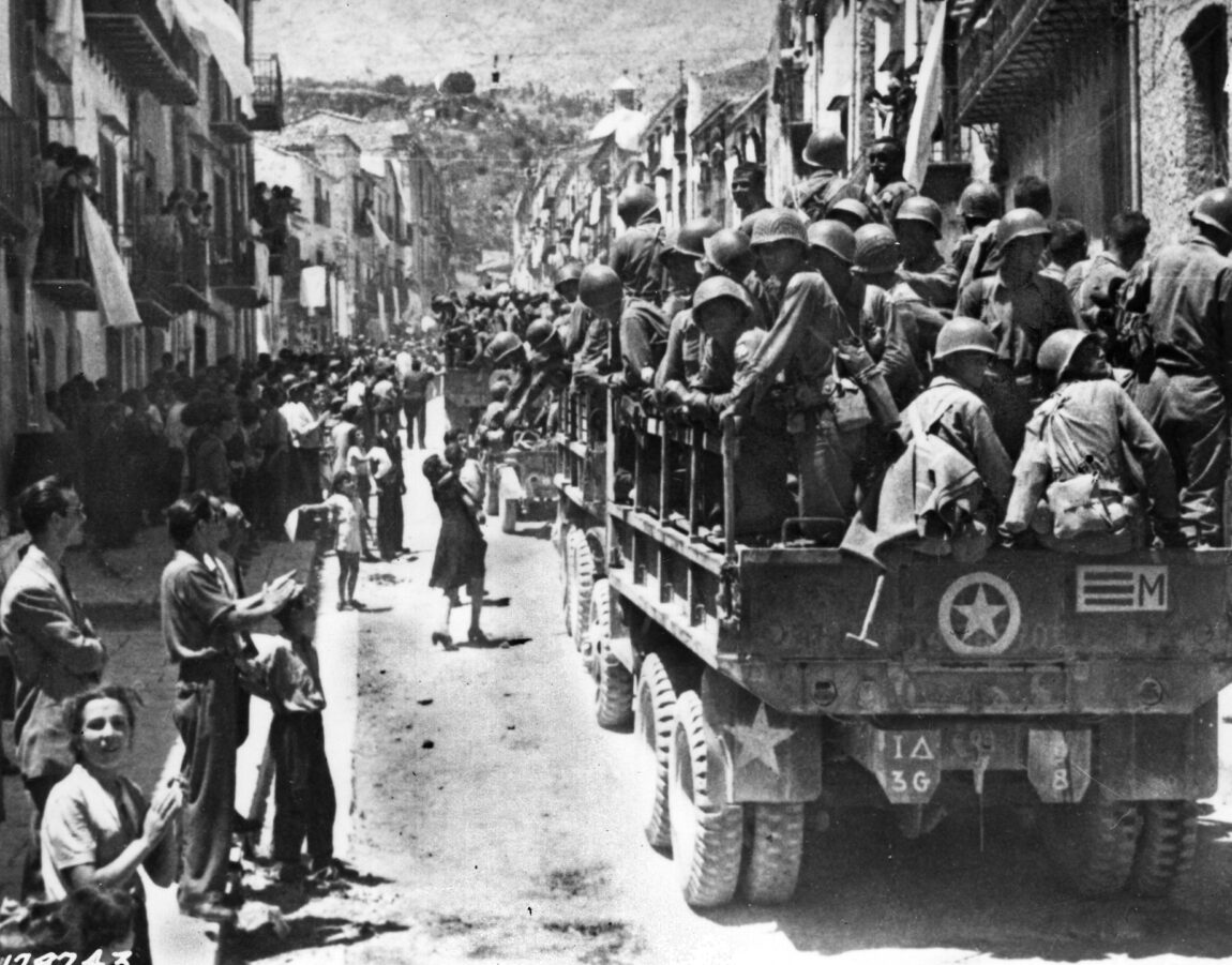 Civilians in Palermo’s theater district cheer and wave to the Americans, whom they treated as liberators.