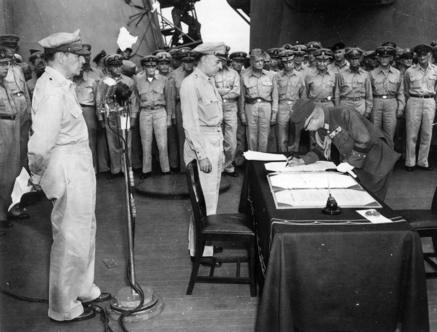 This photo of General Douglas MacArthur at the microphone was taken by Charles Restifo during the Japanese surrender ceremony aboard the USS Missouri.