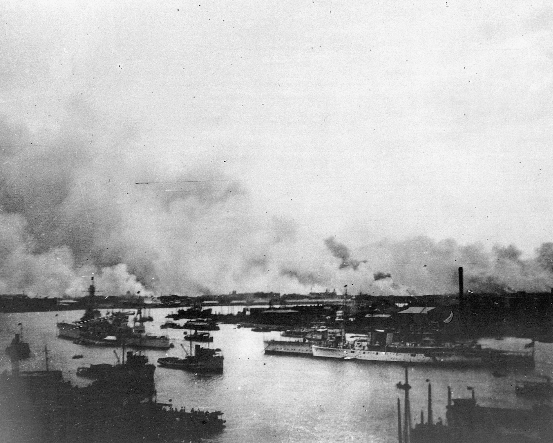 Foreign warships ride at anchor in the Whangpoo River at Shanghai.