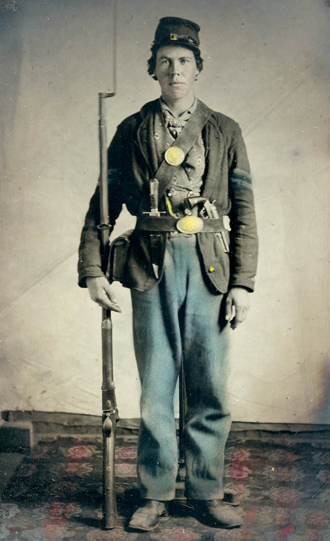 Private Hiram M. Kersey of the 44th Iowa Infantry Regiment, appears well equipped, with his rifle, bayonet, knife, and revolver. He also appears to be wearing a fancy, non-issue vest.