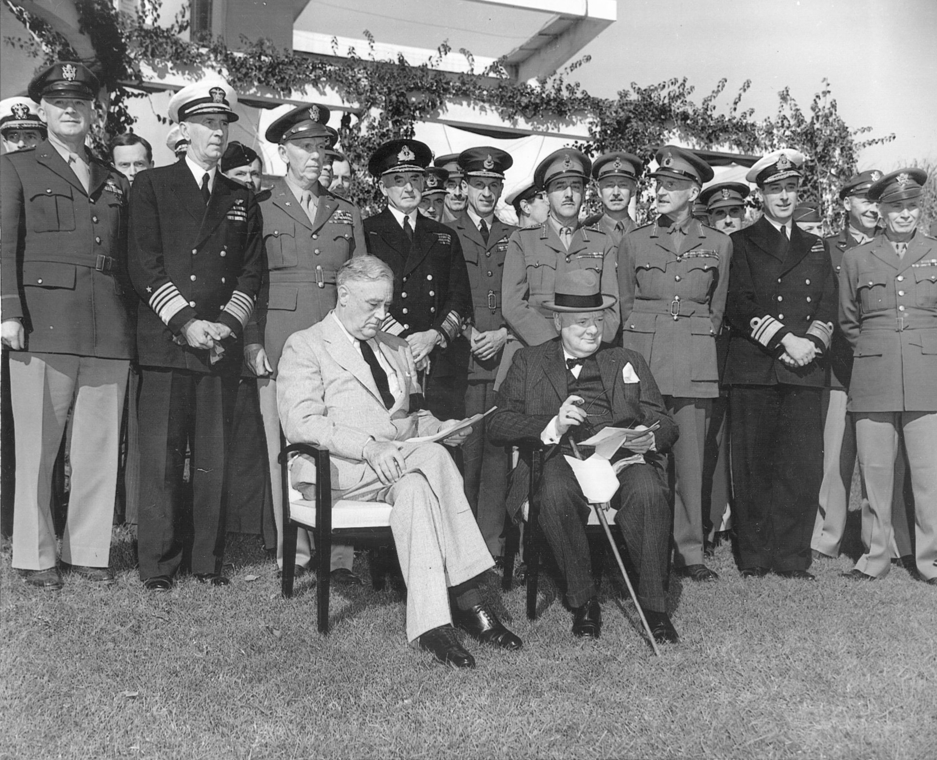 Roosevelt and British Prime Minister Winston Churchill pause with their staffs during the Casablanca Conference.