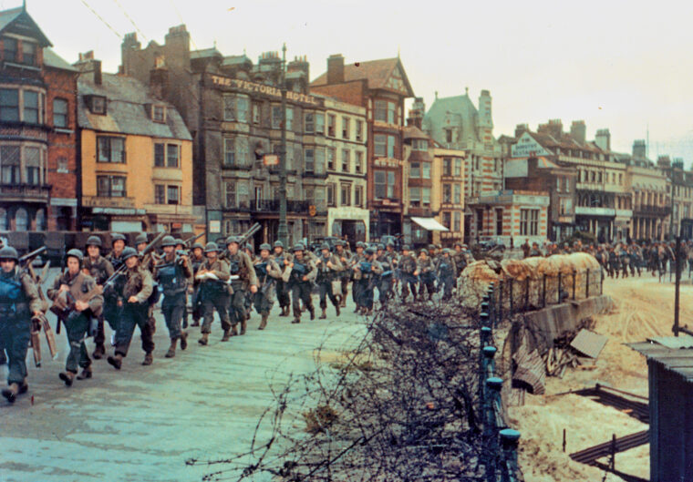 Marching through the southern English port city of Weymouth, U.S. Rangers head to the boats that will take them across the English Channel to either death or glory.
