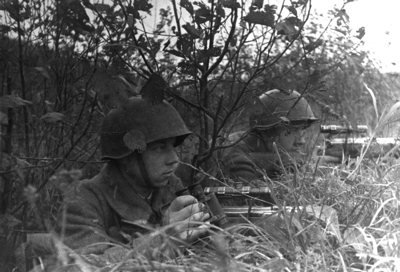 Sergeant Mikhail Markovichenko and his student Nikolai Sefin use a barricade of downed trees as a sniper’s nest and keep a sharp eye out for movement to their front.