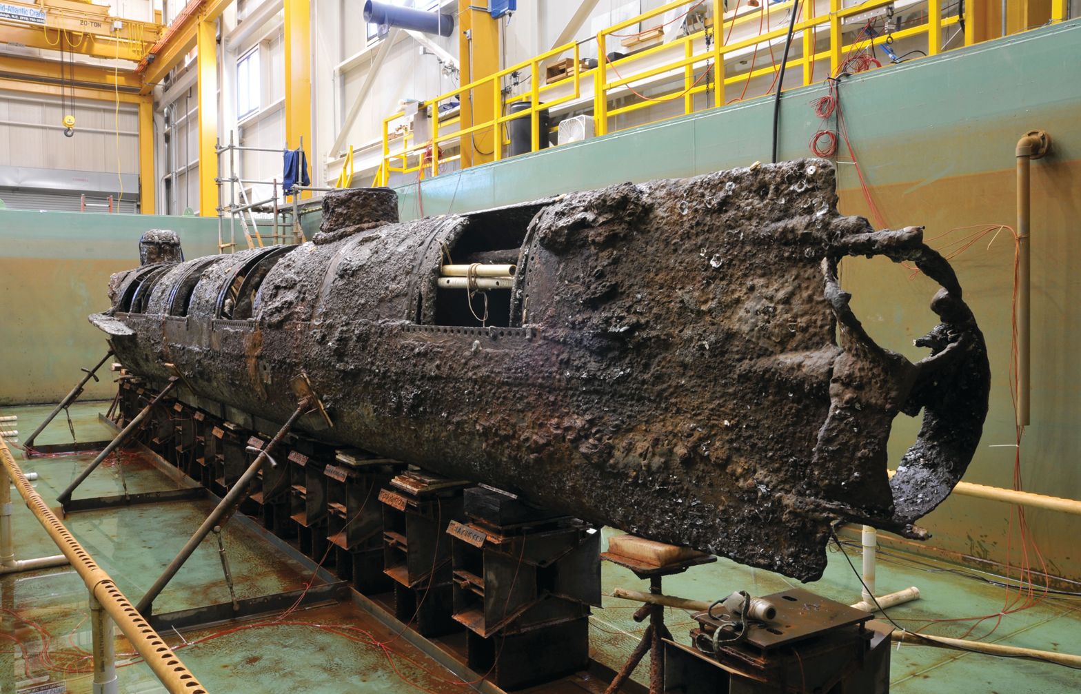 The Hunley, which was raised in 2000, is now stored in a specially designed tank to preserve its fragile hull.