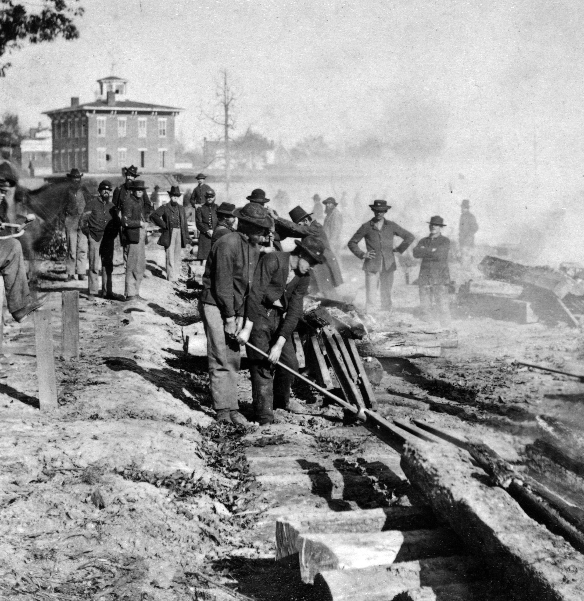 As General Sherman’s troops advanced south toward Jonesborough, they stopped to tear up sections of the Atlantic & Western Railroad.