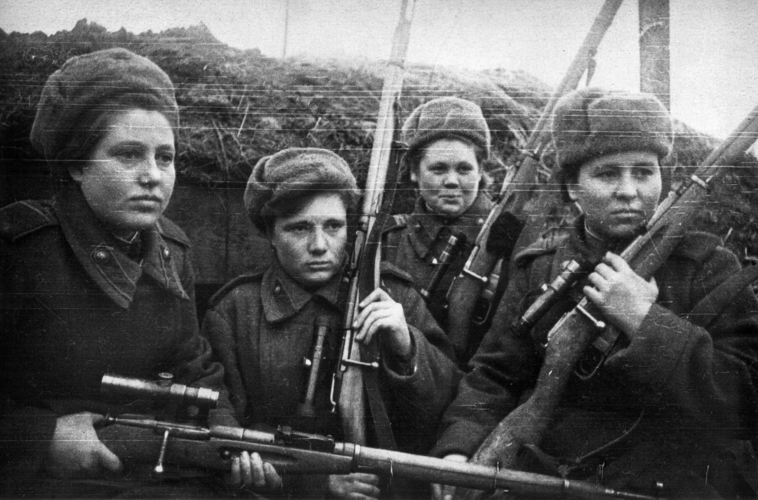 These female Soviet snipers posed for the photographer with grim determination. Allerberger took out a group of female snipers firing at German soldiers from trees.