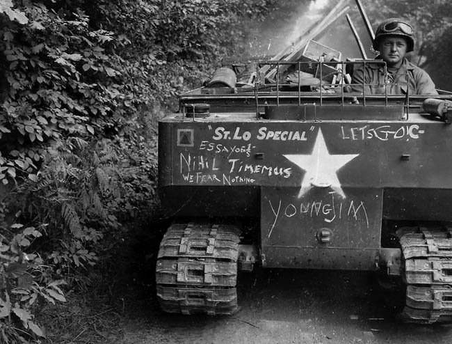 This M29 Weasel amphibious tracked vehicle of Company C, 1st Engineer Combat Battalion, 29th Infantry Division has been nicknamed the St. Lo Special. This photo was taken in France during the summer of 1944.