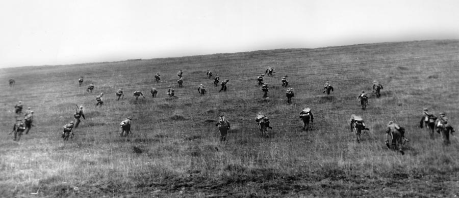 Rommel's soldiers charge up a hill in France, 1940. Rommel led from the front lines and enjoyed photographing his infantry in action.