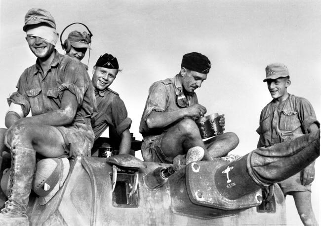 Soldiers of the Afrika Korps pose on top of a tank, circa 1941. Rommel photographed many scenes from soldiers' everyday lives on the front lines. Unlike staged photos taken by Nazi propagandists, Rommel's photographs of his men were candid and unpolished.