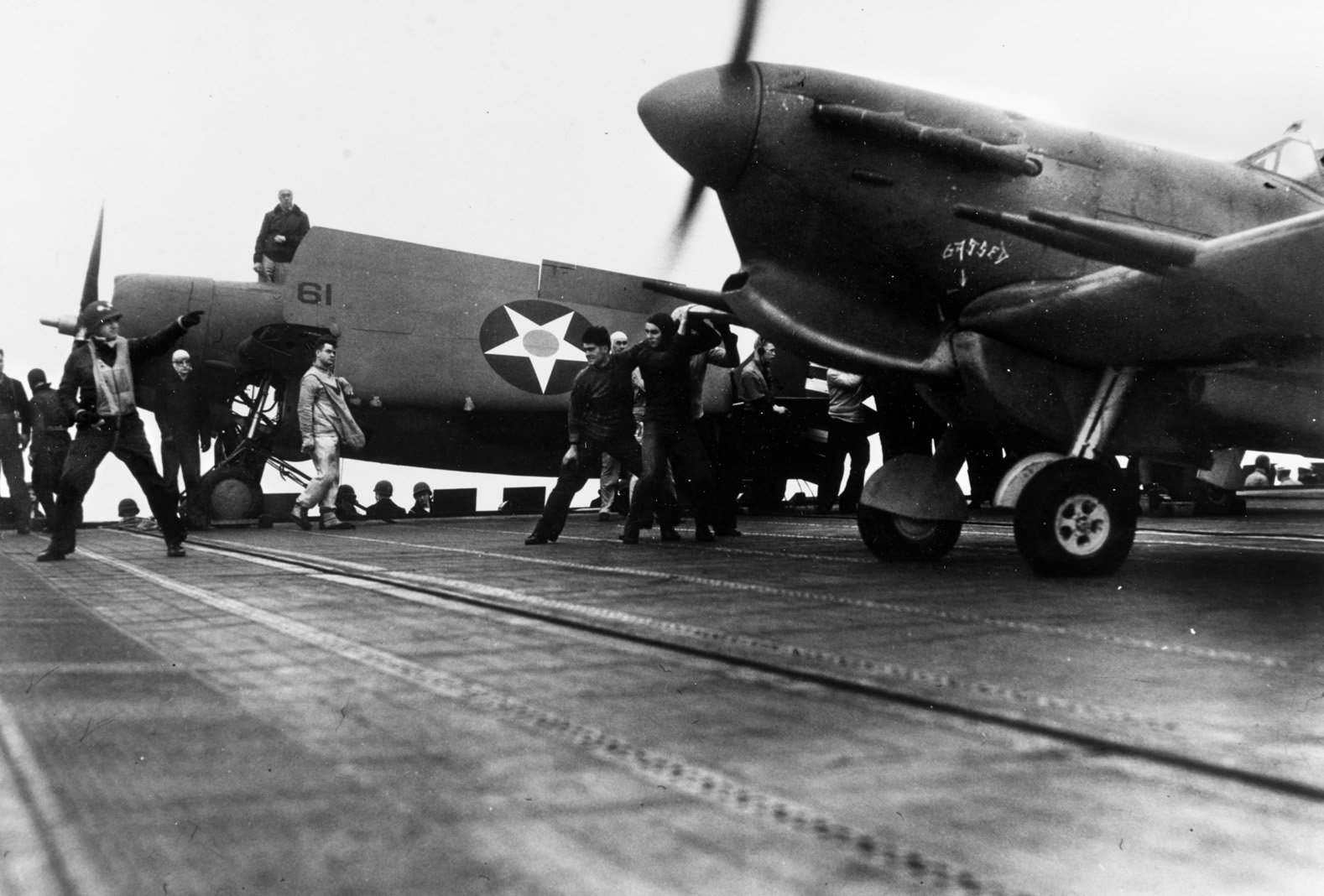 The U.S. aircraft carrier Wasp brought 47 Spitfires to Malta on May 9, 1942, where they were used to counterstrike German and Italian ships and aircraft. Here a Spitfire, with a Grumman F4F Wildcat in the background, prepares to launch.