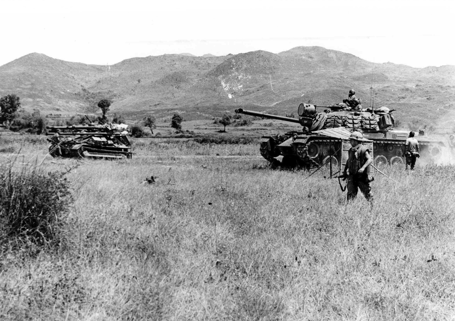 An M-48 tank accompanies an Ontos in South Vietnam.