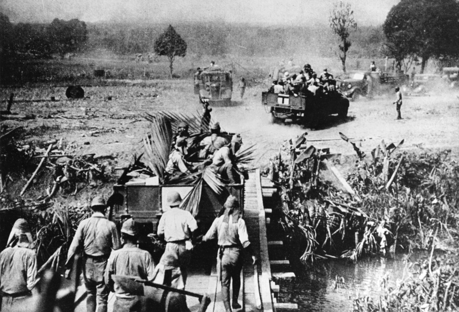 In this April 3, 1942, photo, Japanese soldiers move forward on foot and aboard vehicles during their victorious onslaught in the Philippines. The Japanese occupation of the Philippines was completed with the surrender of American and Filipino troops on the Bataan Peninsula and the island of Corregidor.