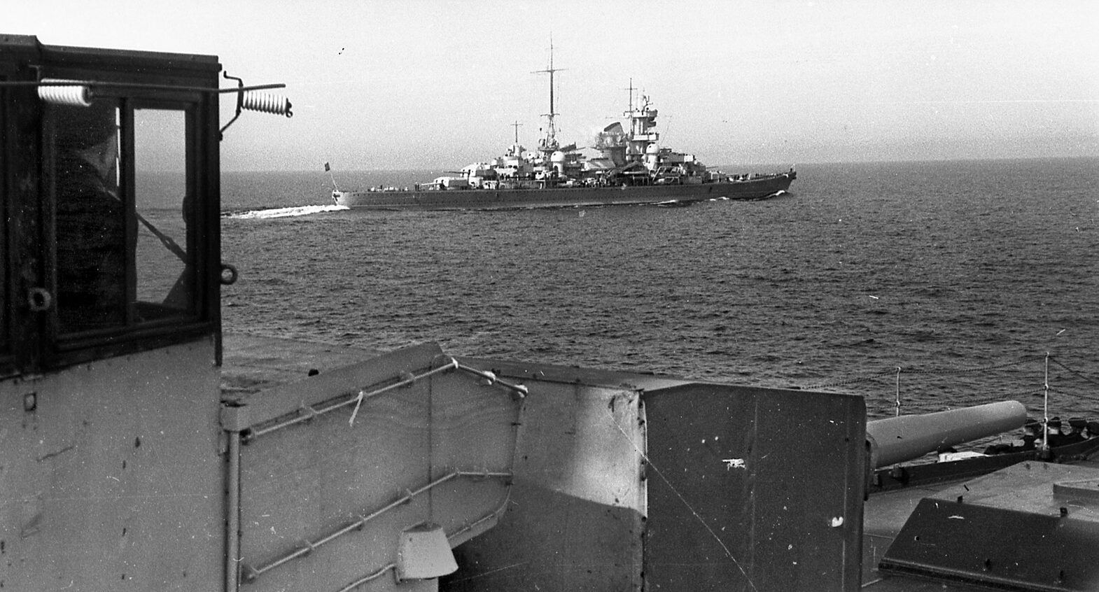 En route to its fate during the invasion of Norway, the Kriegsmarine heavy cruiser Blücher sails in company with other German warships. This photograph was taken from the deck of the light cruiser Emden.