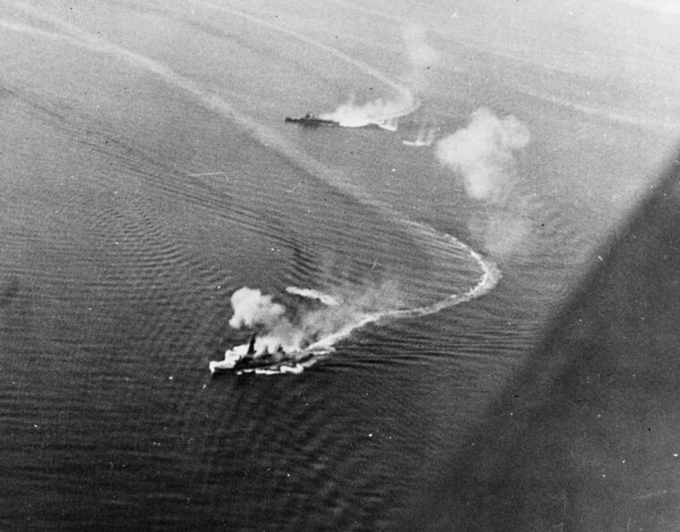 The Japanese battleship Fuso and heavy cruiser Mogami endure air attack by U.S. Navy planes just prior to the Battle of Surigao Strait in October 1944. The Surigao Strait action was a component of the larger Battle of Leyte Gulf.