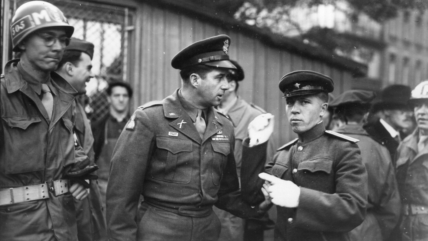 Colonel Bill Yarborough communicates with an officer of the Soviet Red Army while working as the military police chief in postwar Vienna, Austria.