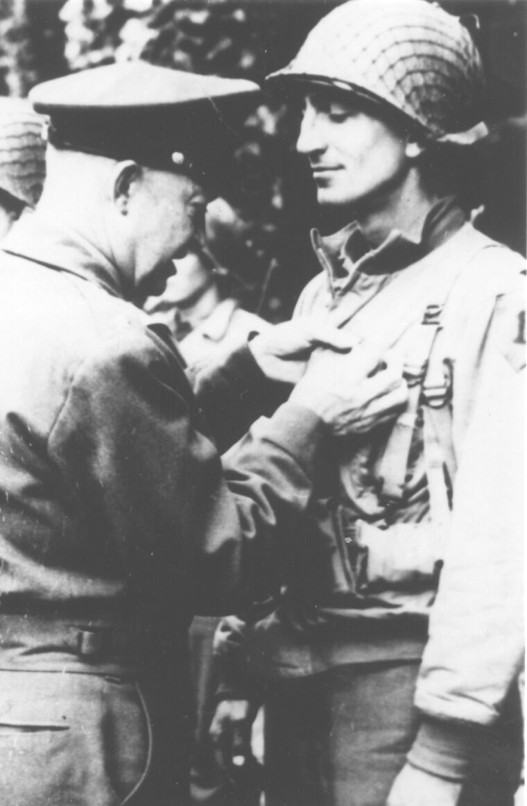Captain Joe Dawson is decorated by General Eisenhower.