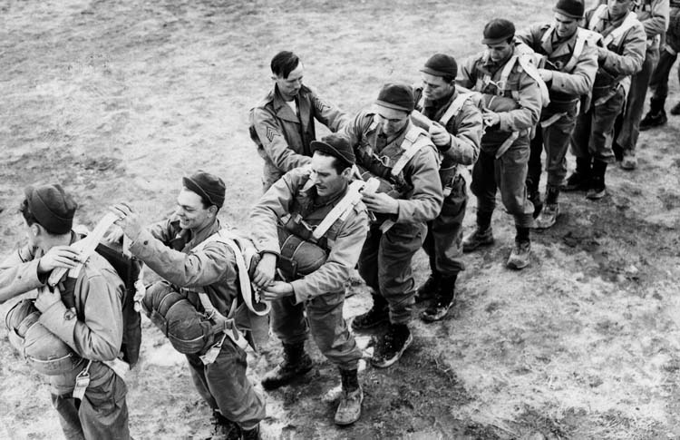 Prior to their first airborne jump during 1943 training exercises, members of the 1st Special Service Force adjust parachute lines for one another. The Devil’s Brigade was a versatile, hard-fighting unit that left a stirring legacy.