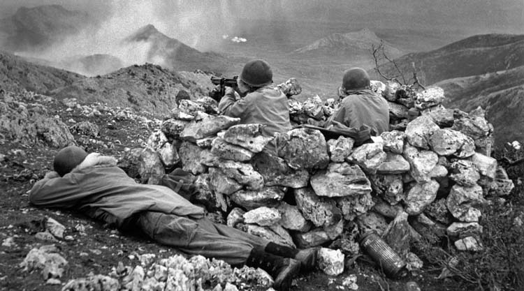 Several weeks after the bitter battle at Monte la Difensa in early December 1943, soldiers of the Devil’s Brigade take up positions in the mountains near the Italian town of Cassino, scene of heavy fighting during the Allied Fifth Army’s push toward Rome.