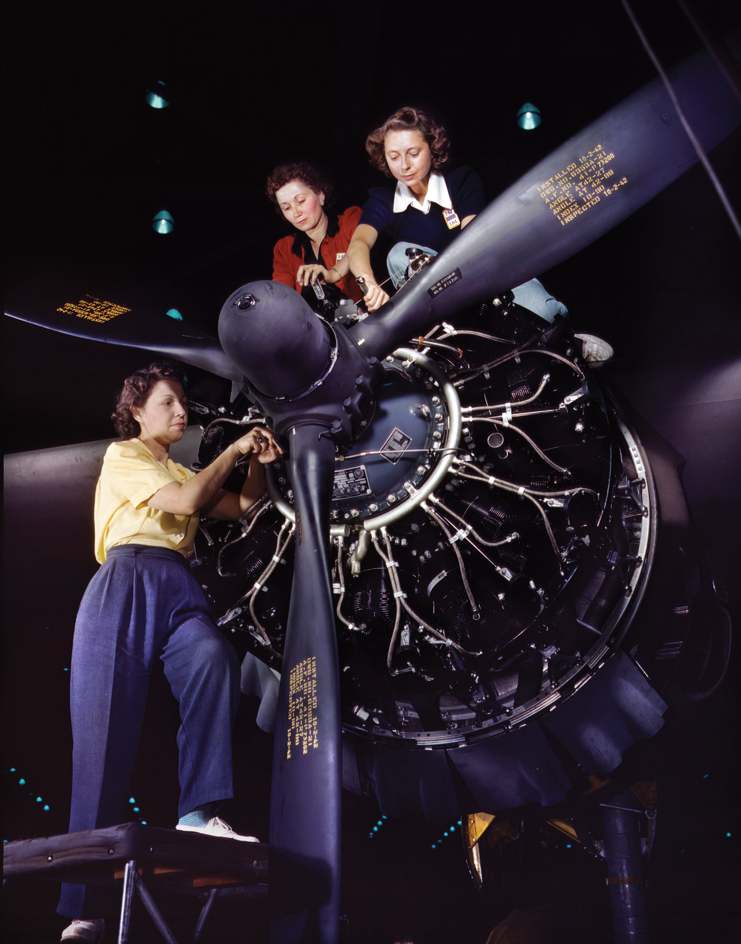 With the wartime manpower shortage, tens of thousands of women were brought into the workforce. Here, three women pose for a publicity shot while working on an engine at the Douglas Aircraft Company’s factory in Long Beach, California.